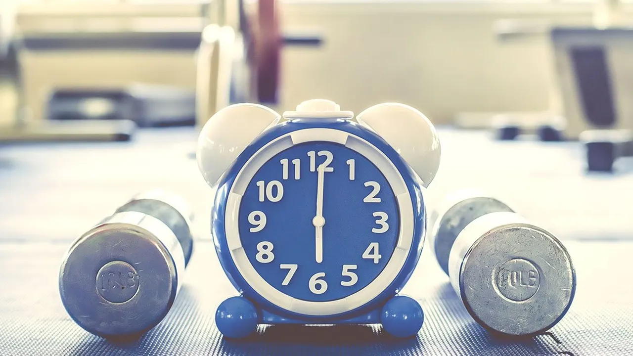 Close up on a plate of mashed potatoes, topped with baked pork chops with cream of mushroom soup, and a side of green beans.