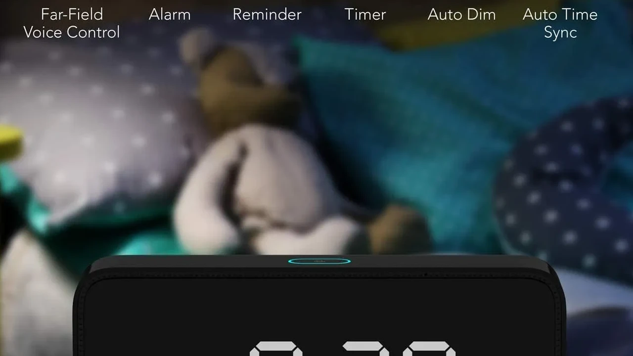 Close up on a plate of mashed potatoes, topped with baked pork chops with cream of mushroom soup, and a side of green beans.