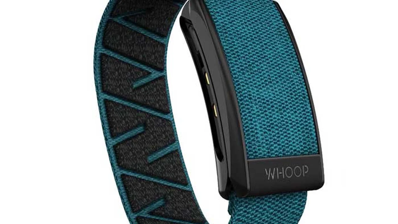 Close up on a plate of mashed potatoes, topped with baked pork chops with cream of mushroom soup, and a side of green beans.